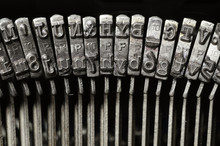 Close-up Of Typewriter Letter And Symbol Keys