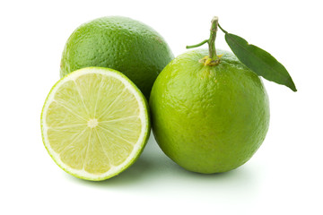Wall Mural - Ripe limes with green leaf
