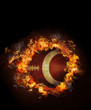 Image of hot burning football on black background