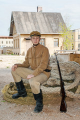 Wall Mural - Retro style picture with soldier sitting on the rope