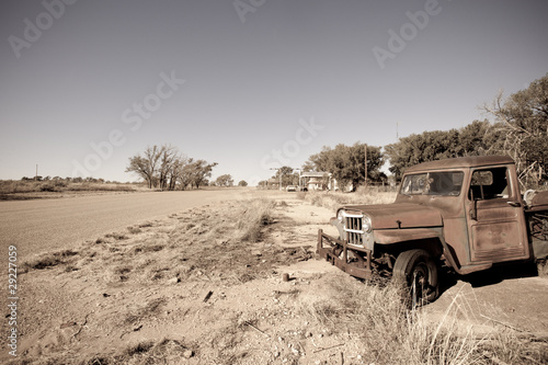 Old rusty car along historic US Route 66, Texas Poster