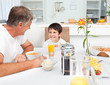 © WavebreakMediaMicro - Father having his breakfast with his son