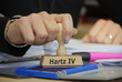 © Gerhard Seybert - Stempel mit Hand und Hartz IV