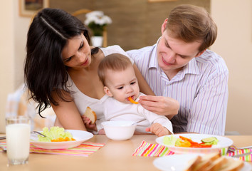 young family at home having meal