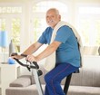 © nyul - Senior man smiling on fitness bike