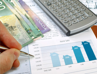 Fototapete - Male hand with pen on the investment chart with dollars