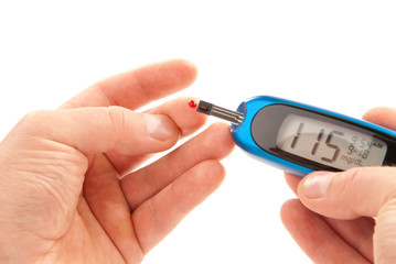 Diabetic patient doing glucose level blood test