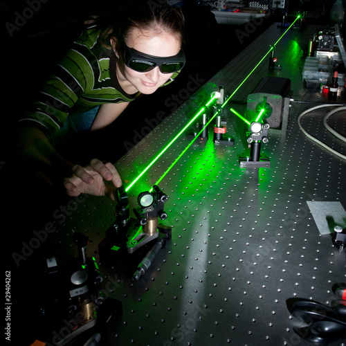 Fotografie, Obraz female scientist doing research in a quantum optics lab