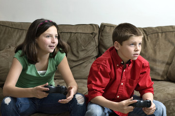 Sister and brother playing a video game