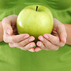 Wall Mural - apple in woman hands