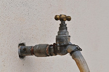 Old Water Tap And Hose