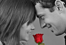 Beautiful Young Couple With Red Rose