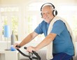 © nyul - Active pensioner doing spinning with music