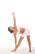 yoga pose - female in sport clothes performing exercise