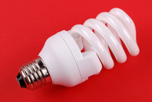 Energy Saving Bulb On Red
