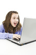 © Jelena Ivanovic - Surprised girl with laptop over white