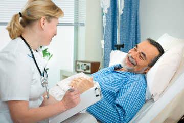 Wall Mural - doctor or nurse talking to patient in hospital