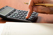 © Minerva Studio - Businessman working with the calculator in his office