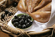 Chiabatta with olives on bakery basket