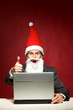 © pikselstock - Santa with laptop