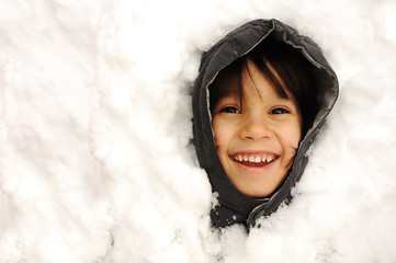 Wall Mural - Cute kid in snow, snowtime, winter, happiness