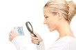 woman with magnifying glass and money