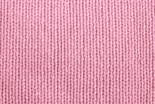 Closeup Of Seamless Pink Knitted Fabric Texture