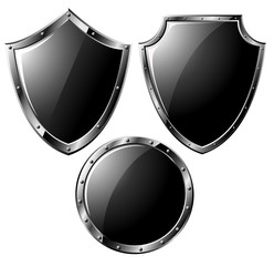 Set of black steel shields - isolated on white