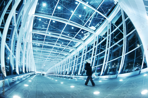 Fotografie, Obraz People walking in modern blue walkway interior