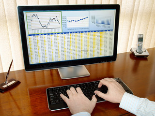 Fototapete - Analizing data on computer