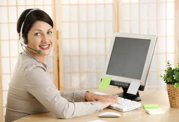 Wall Mural - Young woman working at home