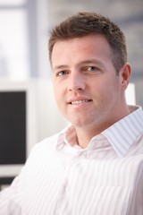 Poster - Portrait of middle-aged office worker smiling