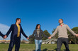 © william87 - Multiracial Young People Holding Hands in a Circle