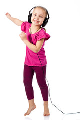 Beautiful girl in headphones dancing to the music