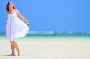 Wall Mural - Woman enjoying beach vacation