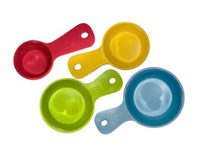 Different Sizes Of Measuring Cups On A White Background