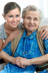 Wall Mural - Senior woman with her home caregiver