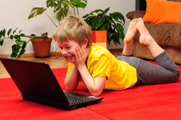 happy boy with computer