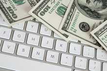 Hundred Dollar Bills On Computer Keyboard