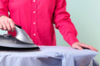 © RTimages - Woman ironing a shirt