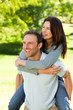 © WavebreakMediaMicro - Man giving wife a piggyback