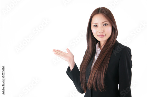笑顔で左手で案内するスーツの女性 Stock Photo Adobe Stock 笑顔で左手で案内するスーツの女性 Stock Photo Adobe Stock