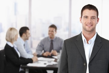 Wall Mural - Portrait of businessman in meeting room