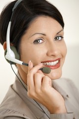 Wall Mural - Happy woman talking on headset