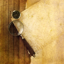 Compass With Magnifying Glass On Wooden Background