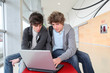 © goodluz - Group of teenage boys at school with laptop computer