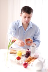 Poster - man having breakfast at home