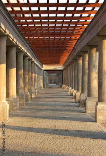 Fototapeta na wymiar pergola with stone columns and pavement floor