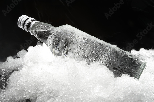 Naklejka na szybę Close up view of the bottle in ice