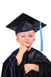 © Temych - Cute little boy in graduation gown thinking